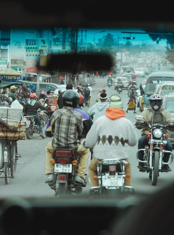 people in motorcycles on road