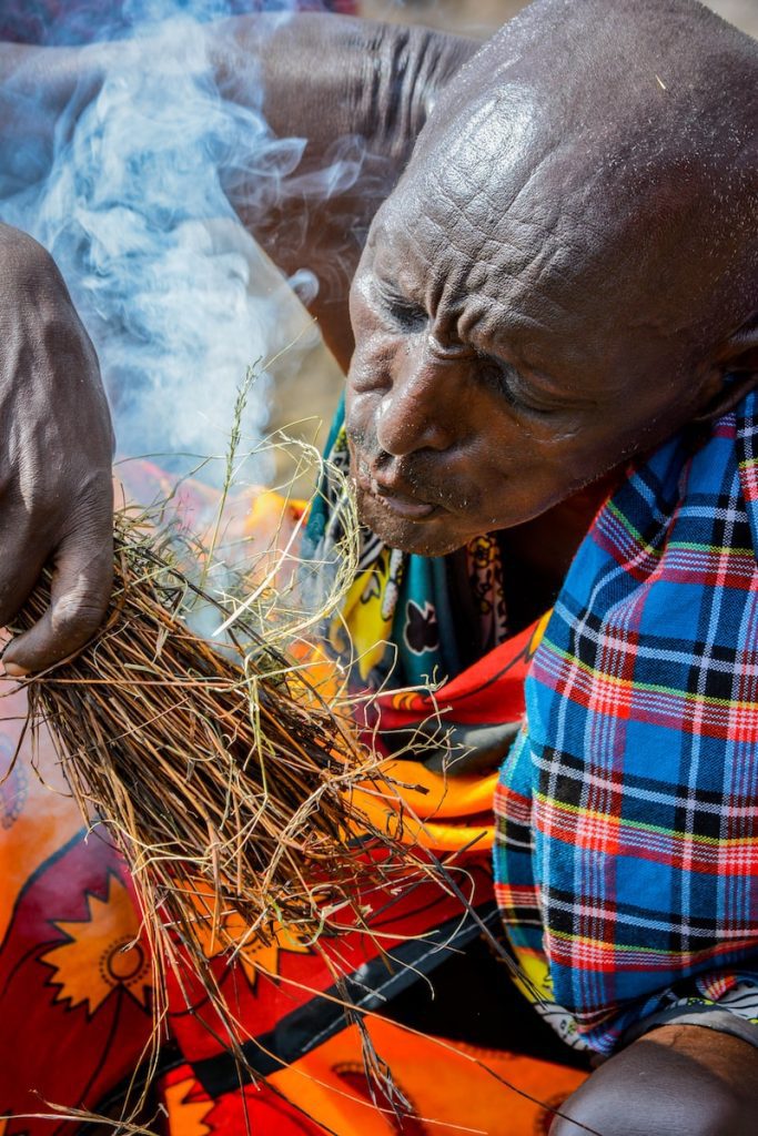 person making fire