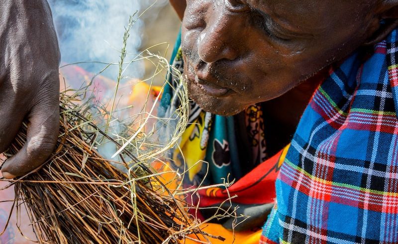 person making fire